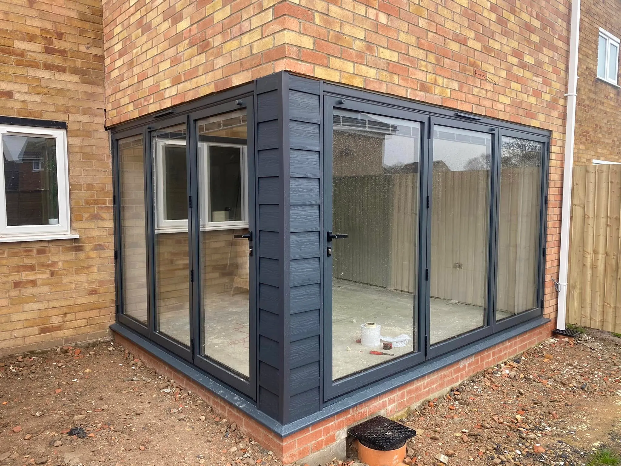 Anthracite grey lean-to conservatory with French doors