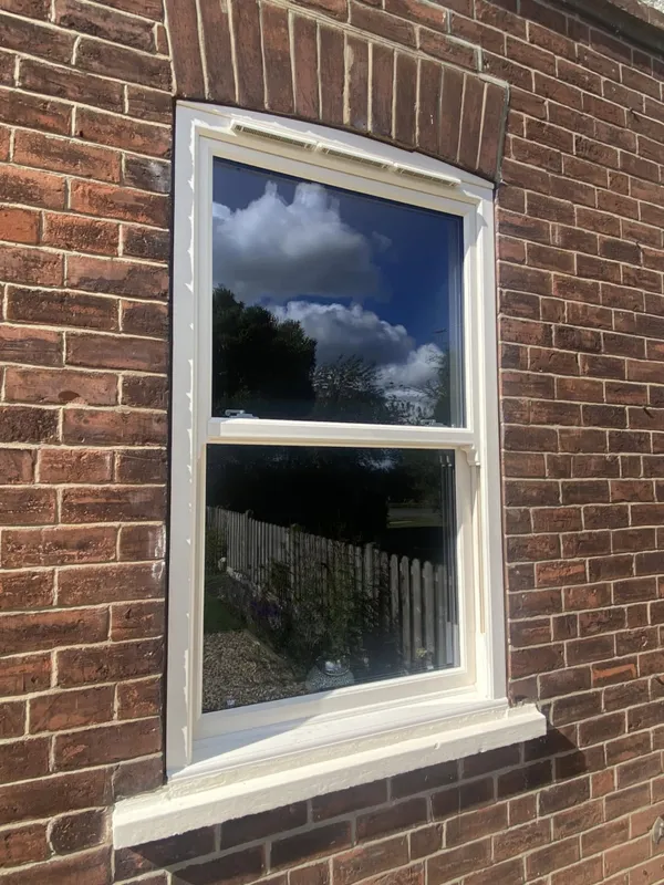 Composite door with decorative glass