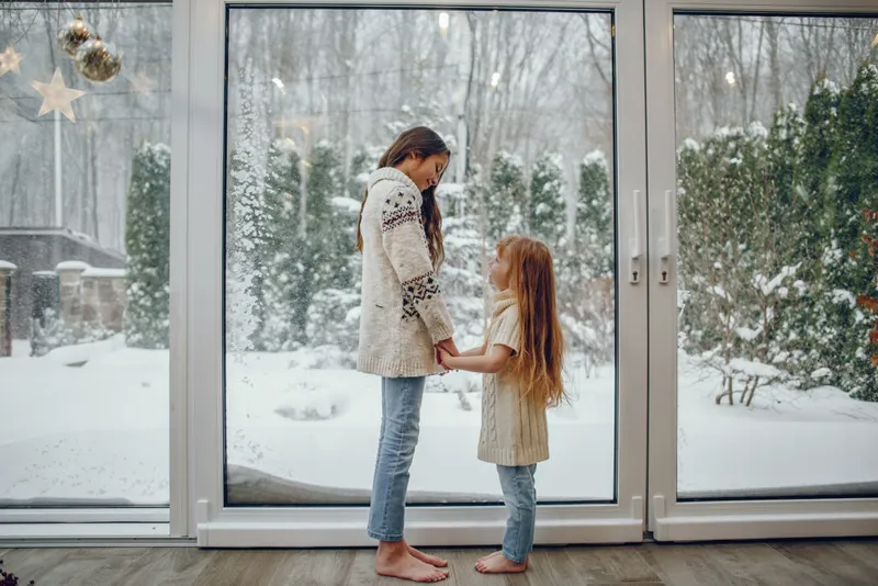 Family enjoying warm home with energy efficient windows
