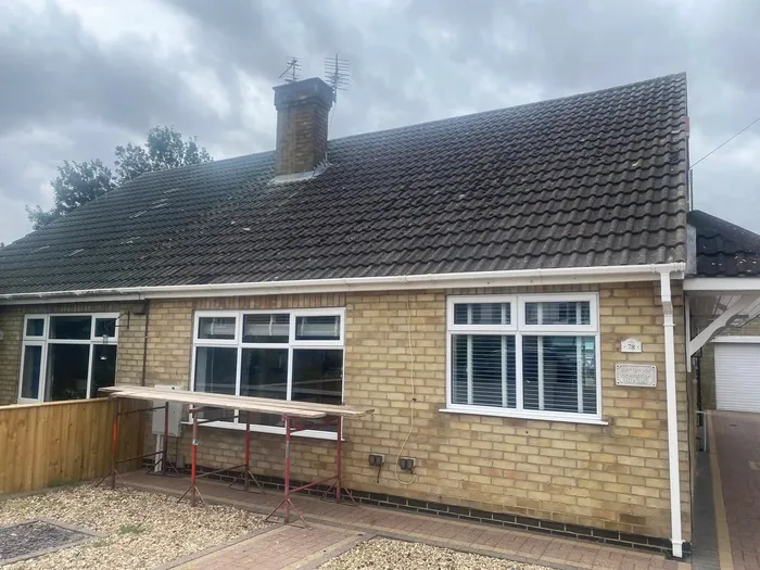 House before full window replacement - old white windows